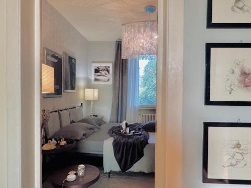 Ένα ή περισσότερα κρεβάτια σε δωμάτιο στο Villa Nuvola Suites
