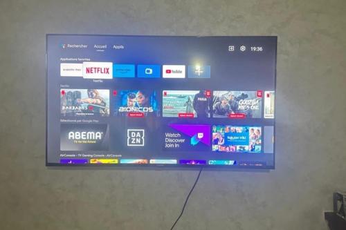 a television screen on a wall with a bunch of websites at Luxury Ifrane House in Ifrane