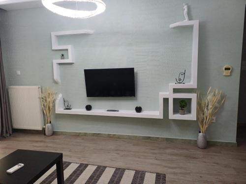 Una televisión o centro de entretenimiento en VATA Apartaments