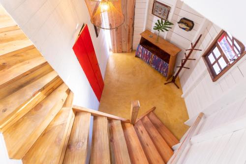 an overhead view of a staircase in a tiny house at Hostel Da Vila Ilhabela in Ilhabela