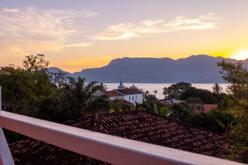 a view from the roof of a house at sunset at Hostel Da Vila Ilhabela in Ilhabela