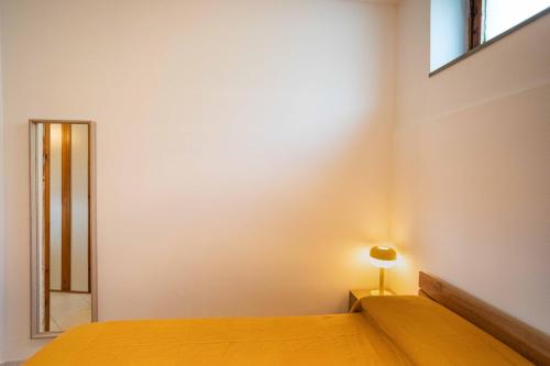 Ένα ή περισσότερα κρεβάτια σε δωμάτιο στο Casa Gnappa