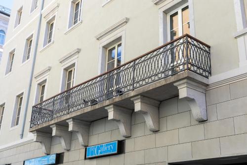 a balcony on the side of a building at Teatro Romano Exclusive Suites in Trieste
