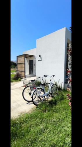 two bikes parked in front of a building at Aphrodite Luxury Suites with private heated pools in Kos Town