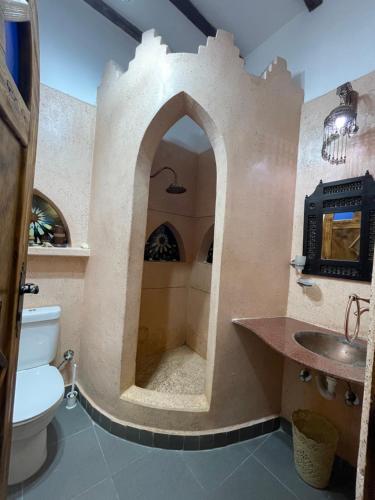 a bathroom with a sink and a toilet in a room at Villa Andalusia Dahab blue in Dahab