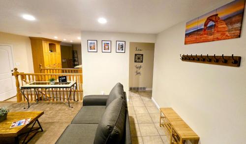a living room with a couch and a table at Booking - Hoskere Homes in Sandy