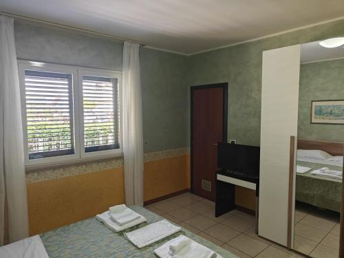 Postel nebo postele na pokoji v ubytování Hotel Roma Sul Mare