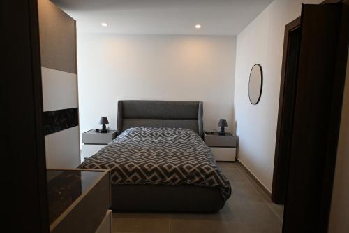Cama o camas de una habitación en Highland Residence Apartment