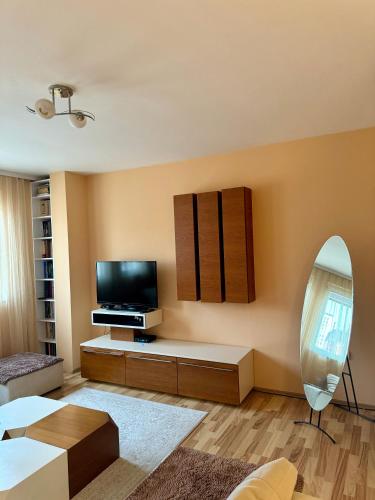 Una televisión o centro de entretenimiento en Park Street Apartments