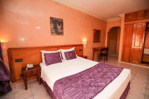 Postel nebo postele na pokoji v ubytování Hotel Majorelle