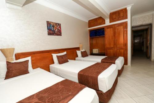 Postel nebo postele na pokoji v ubytování Hotel Majorelle