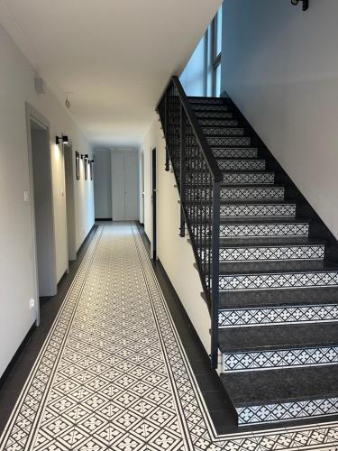 a hallway with stairs in a building at Port Rewa in Rewa