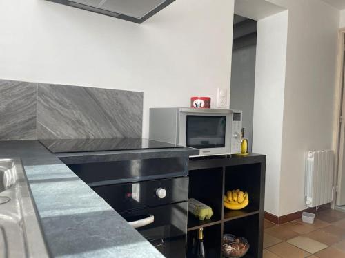 Η κουζίνα ή μικρή κουζίνα στο Charmante maison, cœur de bourg