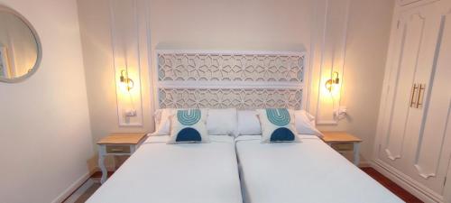 Ένα ή περισσότερα κρεβάτια σε δωμάτιο στο Home Ourense Miño