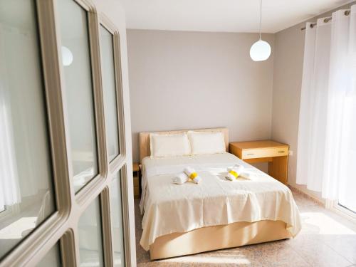 a bedroom with a bed with two bananas on it at Apartment Sweet 2 in Tirana