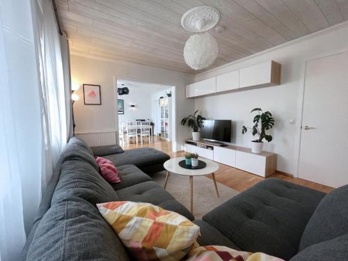 a living room with a couch and a table at Private Retreat by Arctic Circle in Húsavík