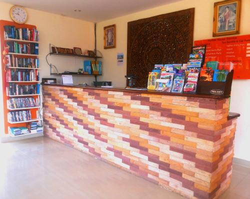 a book store with a colorful counter with books at Hathai House in Lamai