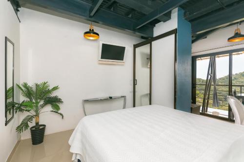 Una cama o camas en una habitación de Vista del Pacifico.