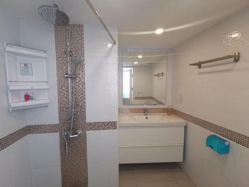 a bathroom with a shower and a sink at Luxury beach studio 9 floor in Pattaya