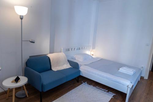 Llit o llits en una habitació de DOWNTOWN STUDIO AP