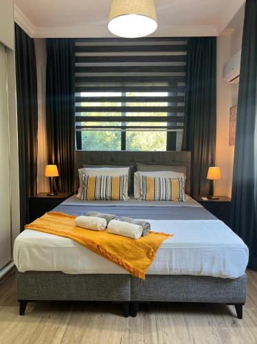 Ένα ή περισσότερα κρεβάτια σε δωμάτιο στο HG Mare Suites