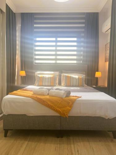 Ένα ή περισσότερα κρεβάτια σε δωμάτιο στο HG Mare Suites