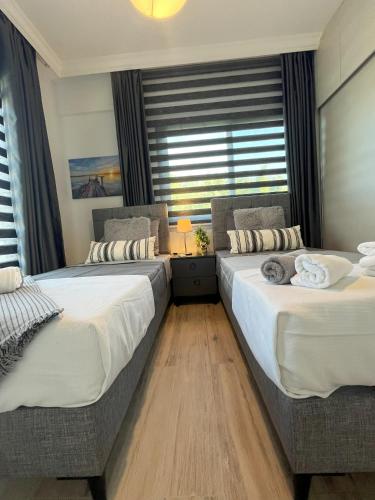Ένα ή περισσότερα κρεβάτια σε δωμάτιο στο HG Mare Suites