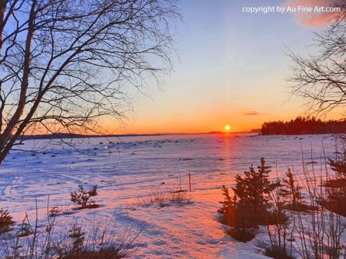 a snowy field with the sun setting in the horizon at Eternus Paradise in Tärnaby