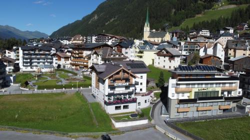 an aerial view of a village with buildings at Hotel Garni Helvetia in Ischgl