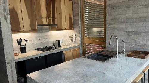 a kitchen with a sink and a counter top at Sich - Casa Macu Saladita surf break in La Salada