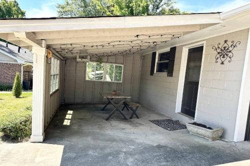 a patio with a picnic table in front of a house at South Perry St in Lawrenceville