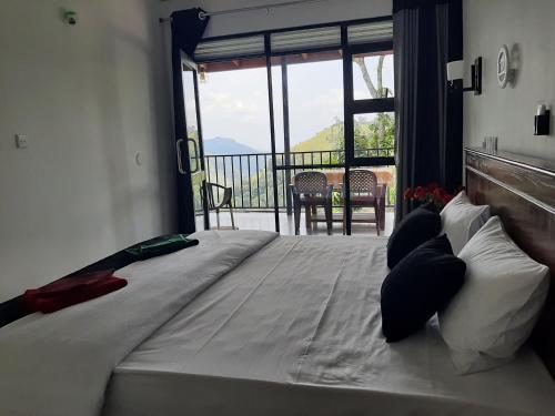 Ένα ή περισσότερα κρεβάτια σε δωμάτιο στο Glorious Nature Inn