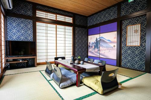 a dining room with a table and chairs at Urayasu Villa in Tokyo