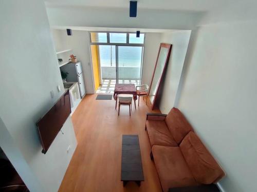 a view of a living room with a couch and a table at Two Bedroom Beachfront Penthouse in Boracay
