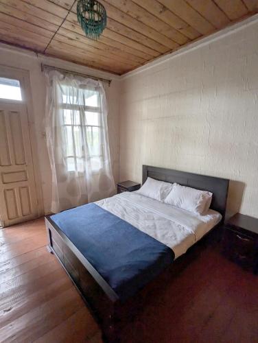 Postel nebo postele na pokoji v ubytování Tasia Guesthouse