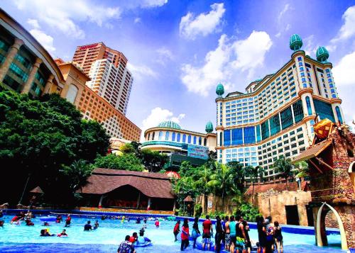 a group of people in a pool at a theme park at Puchong Business Hotel @ Putrajaya in Puchong