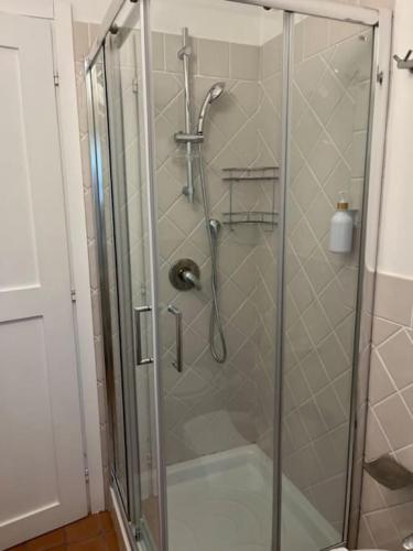 a shower with a glass door in a bathroom at Residenza San Magno in Anagni