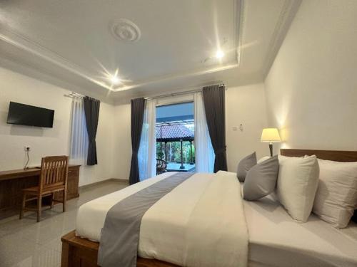 Ένα ή περισσότερα κρεβάτια σε δωμάτιο στο Villa Luwih Pandawa
