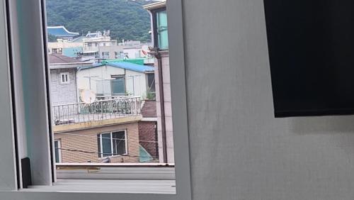 a view of a city from an open window at Kiman09 in Seoul