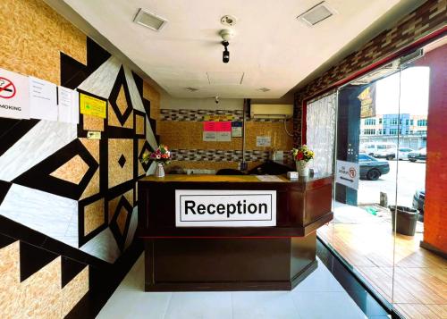 a reception room with a reception desk in a building at ARK HOTEL SUBANG in Shah Alam
