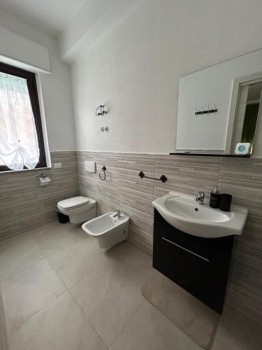 a bathroom with a sink and a toilet at B&B il borgo dei pescatori in Cirò Marina