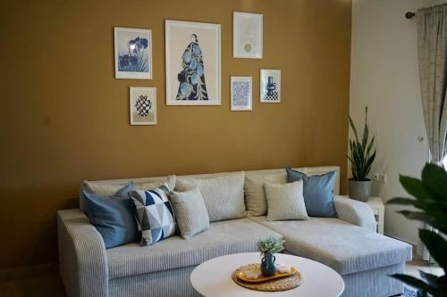 a living room with a couch and a table at The Baker's Loft in Kýthira