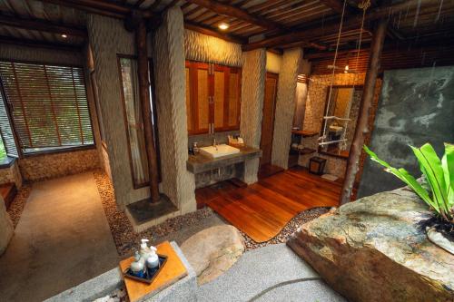 a large bathroom with a sink and a mirror at View Point Resort in Koh Tao