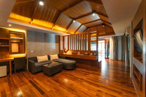 a living room with a couch and a table at View Point Resort in Koh Tao