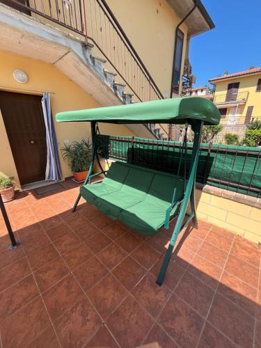 a swing on a balcony of a house at Casa Leah in Montepulciano