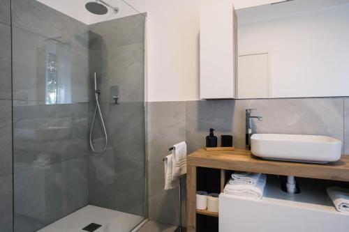 a bathroom with a sink and a shower at Flora Inn, Scotti's House - Due passi in centro in Bergamo