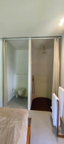 a bedroom with a bathroom with a tub and a bed at Numa Experimental in Pontevedra