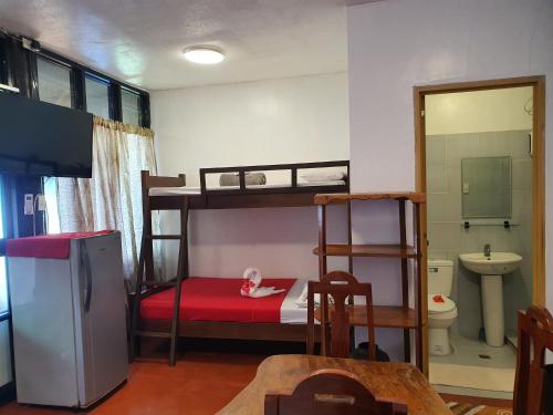 Кровать или кровати в номере Evangeline Resort