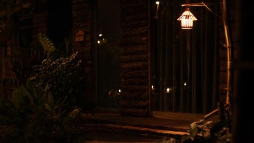 a lit up street light in the dark at Peaceful refuge homestay in Ninh Binh