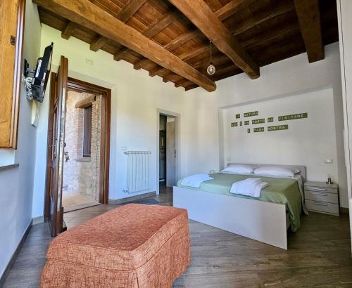 Ένα ή περισσότερα κρεβάτια σε δωμάτιο στο B&B Leofreni Natura